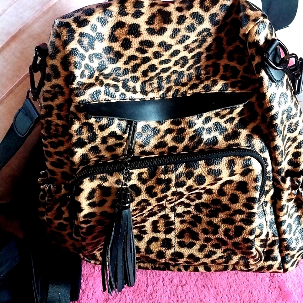Backpack/ handbag leopard collection! With beautiful matching make up Bag and